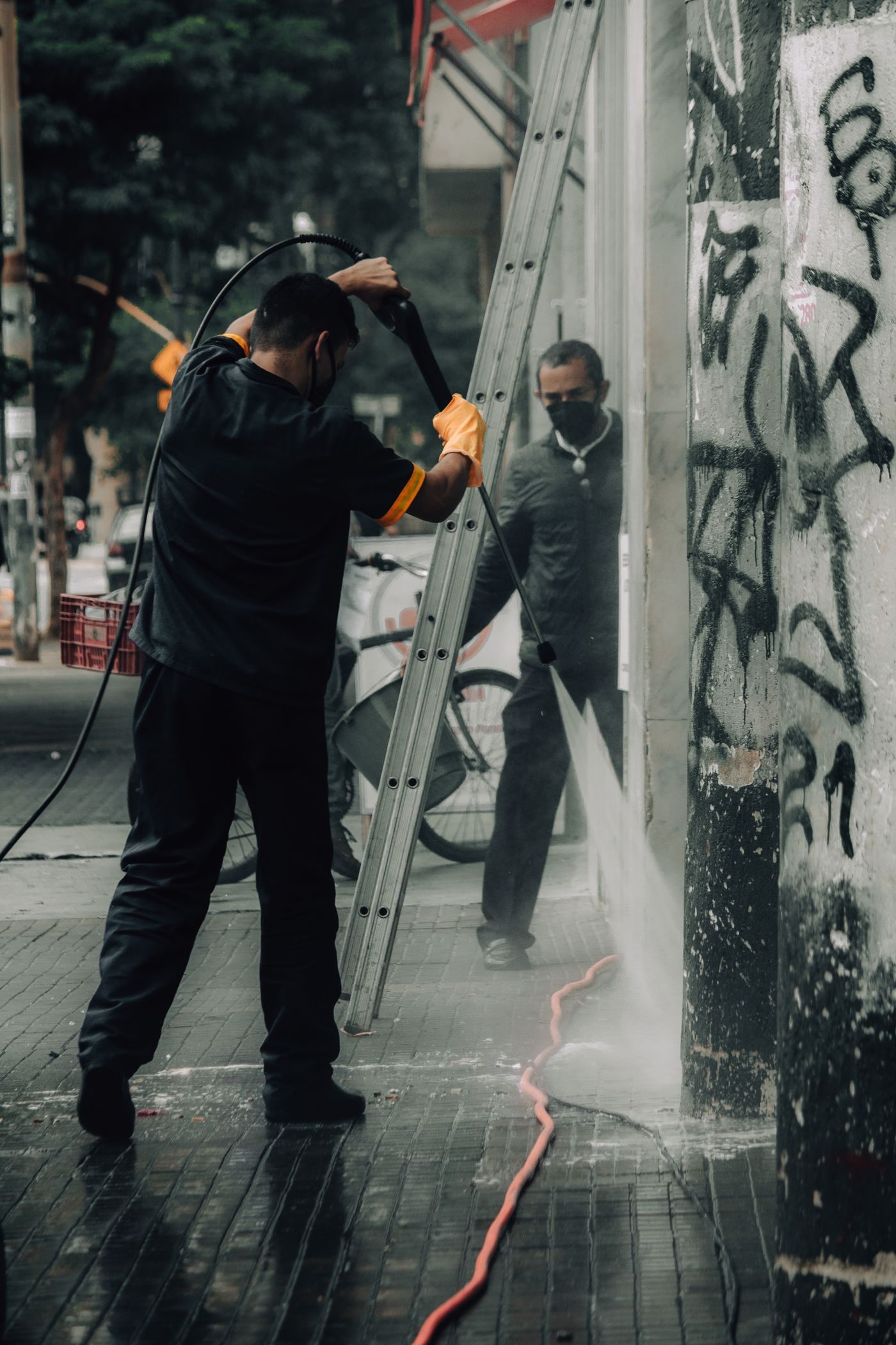 Commercial pressure washing of a storefront and sidewalk